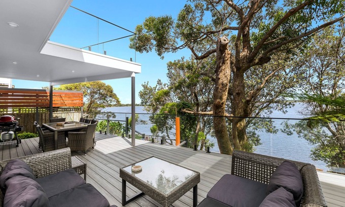 Shoalhaven Heads House | By The River: Large holiday home with river frontage. 2 min walk to the beach.