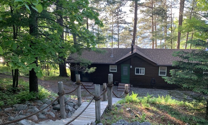 Longville Cabin | Cabin Nestled Amongst Towering Pines Bluff Overlooking nMain Body of Woman Lake