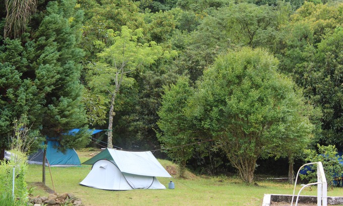 Munhoz RV Rental | Camping area with waterfall and small beach in the Serra da Mantiqueira in Munhoz-MG
