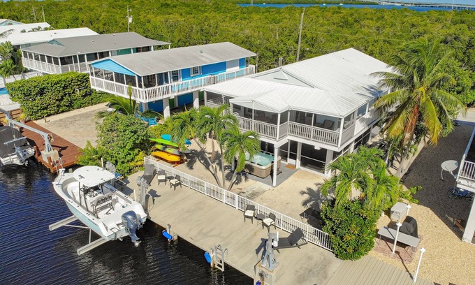 Key Largo House | Canal-front home with private dock, hot tub, water views, kayaks, & deck