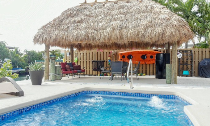 Marathon House | Canal Front Pool Home with Dockage, Jetted Pool, Tiki Hut, 2 Kayaks & 2 Bikes!