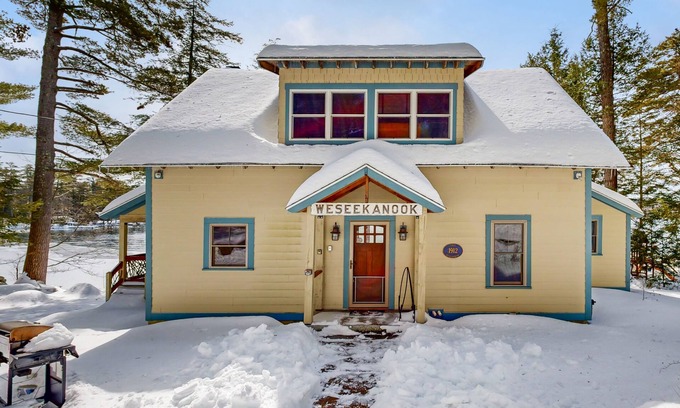 Meredith House | Captivating lakefront home with private dock, row boat, firepit, and lake views