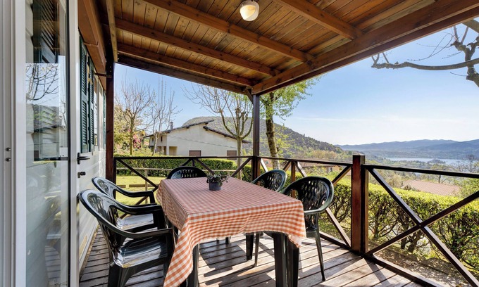 Pratolungo RV Rental | Caravan 'Mobile Home Comfort Vista Lago' with Lake View, Shared Pool and Private Garden