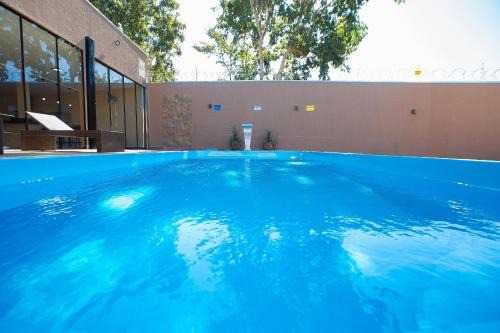 Jardim Paraiso House | Casa com 5 suítes próximo ao lago Corumbá.