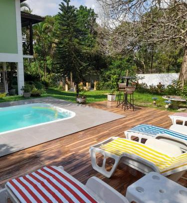 Caneca Fina House | Casa com piscina, espaço gourmet e salão de jogos.