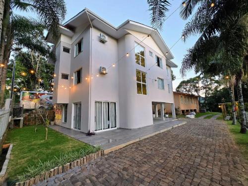 Piratuba House | Casa das Palmeiras