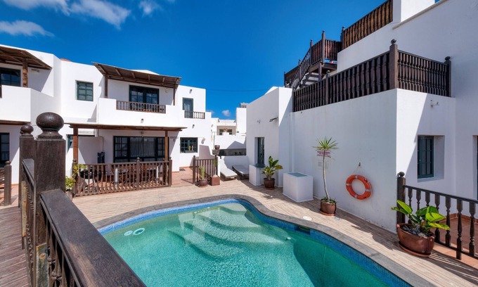 Punta Mujeres Ski Chalet | Casa Hibiscus - Shared Pool and BBQ - Close to Seafront Promenade By Lanzarote Vacation Homes