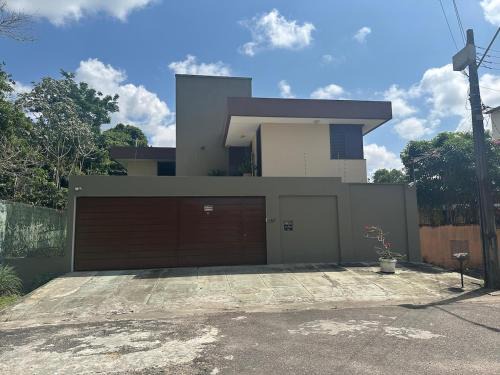 Marambaia House | Casa moderna com vista para floresta