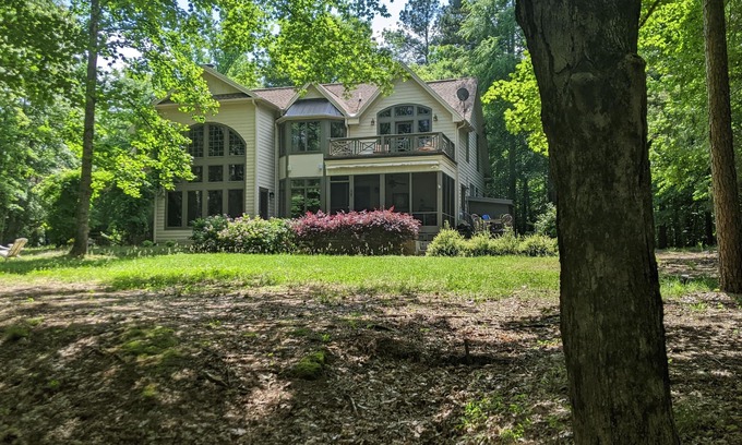 Henderson House | Celebrate Spring! Beautiful, custom Kerr Lake lodge home + private dock.