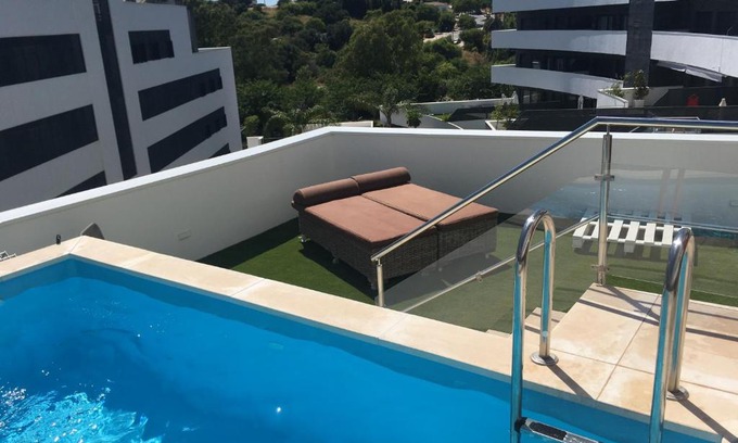 Estepona Apartment | central bright apartment, community pool and own private pool on splendid terrace, garage, beach 900m, mountains 200m