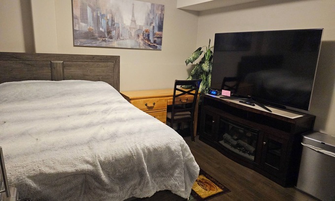 Red Deer House | Charming 1 bedroom rental in a family home in fabulous Red Deer-WiFi, AC & 65"TV