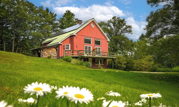 Williamstown House | Charming barn ski house with exposed rustic beams and cathedral ceilings.