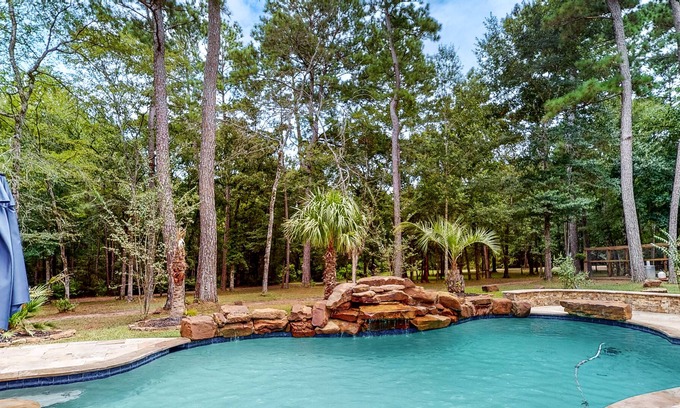 Waller Cabin | Charming cabin with hot tub, full kitchen, firepit, deck, grill, & W/D