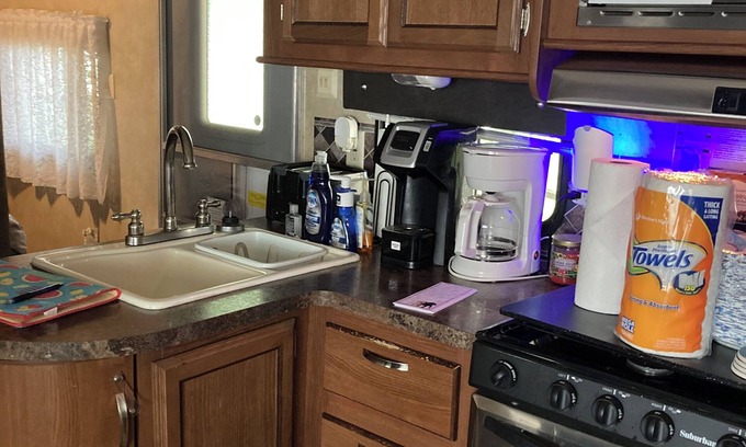 Greenbush RV Rental | Charming camper within Trails End ChinoteagueBay Resort in Horntown VA