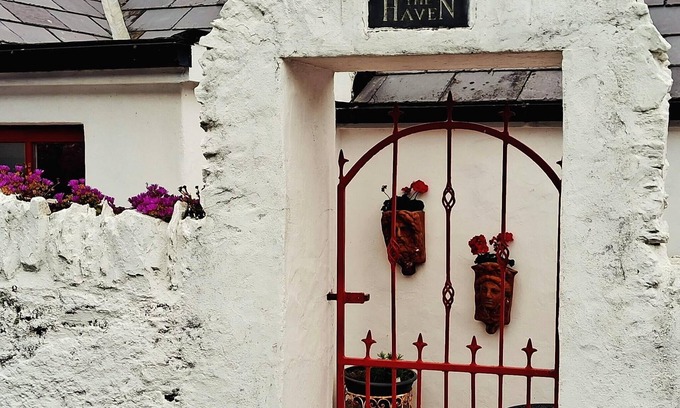 Garryvoe Cottage | Charming Coast guard cottage overlooking Ballycotton harbour. Garden and yard.