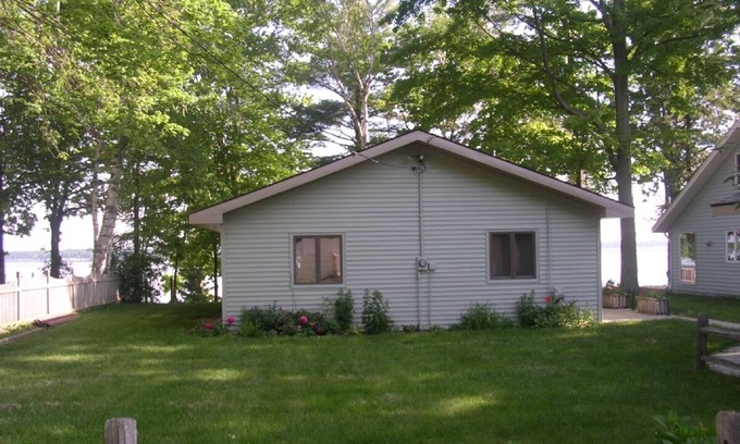 Lake City Cottage | Charming Cottage on Sandy Beach with Beautiful Lake Views from Large Deck