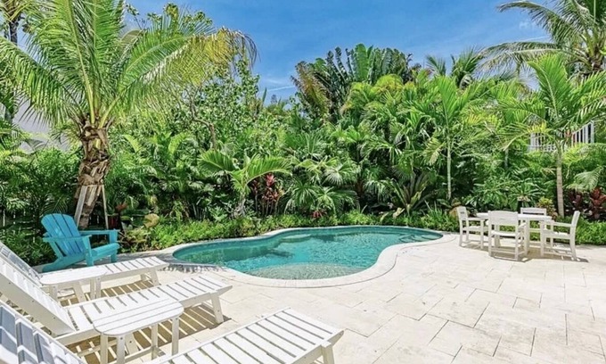 Anna Maria House | Charming cottage with heated pool, tropical landscaping in prime location.