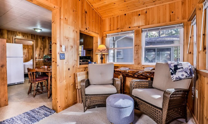 Three Lakes House | Charming, dog-friendly, lakefront cottage with boat dock, grill, & firepit