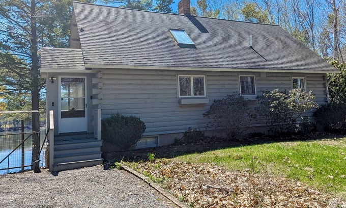 Wiscasset House | Charming riverfront home with cozy interiors, dock, and scenic deck views