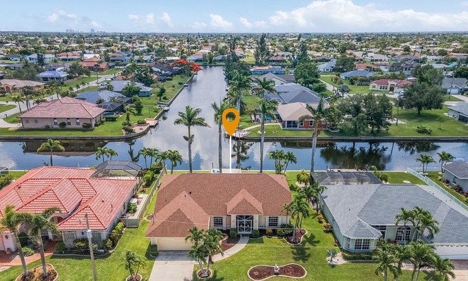 Cape Coral House | Charming Villa Chandelier located at an intersecting canal