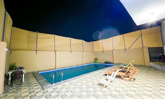Madaba Villa | Cheerful two bedrooms villa with warm pool, playground,& specious sitting room.