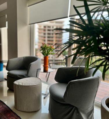 North Hotel Zone Apartment | Chic 1BR 1BA Zoho Skies condo with rooftop pool stunning views