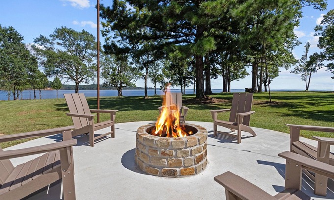 Broaddus House | Chic Lakefront Home | Majestic Views | Cowboy Pool | Outdoor Cinema | Water Toys