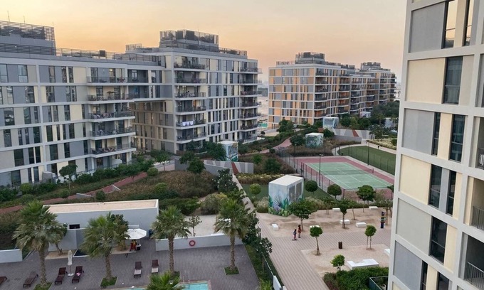Dubai Production City Condo | Chic urban retreat in coveted resort-style spot with pool gym tennis court