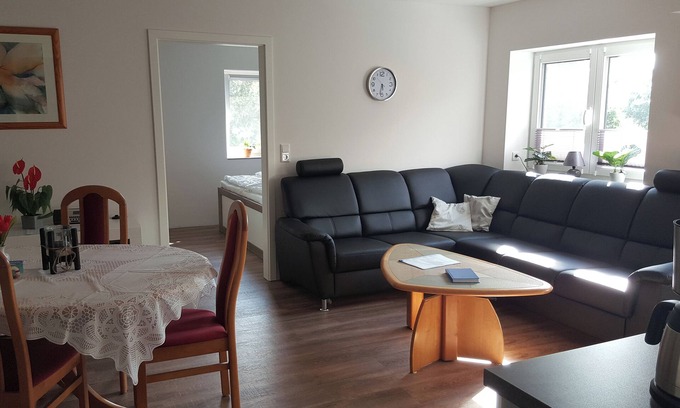 Scholderup Apartment | Chic vacation home, nestled in the beautiful Schleil landscape, 53 square meters of living space, for up to 4 people plus toddler. Facilities: Baby crib, beautiful garden area with play facilities and covered barbecue and smoking area, fly screens.