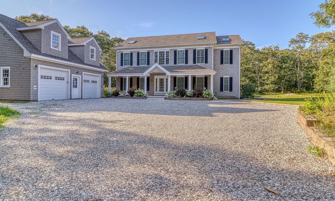 Lagoon Heights House | Classic, private estate with a large lot, a stone patio & a fireplace!