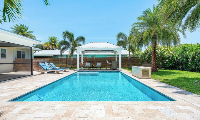 Hunt Club House | Clean Florida Coastal Design home with Heated Pool, Fireplace and Putt Putt