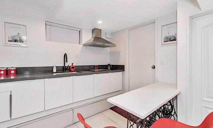 East Danforth House | Clean, white, bright and close to Woodbine subway