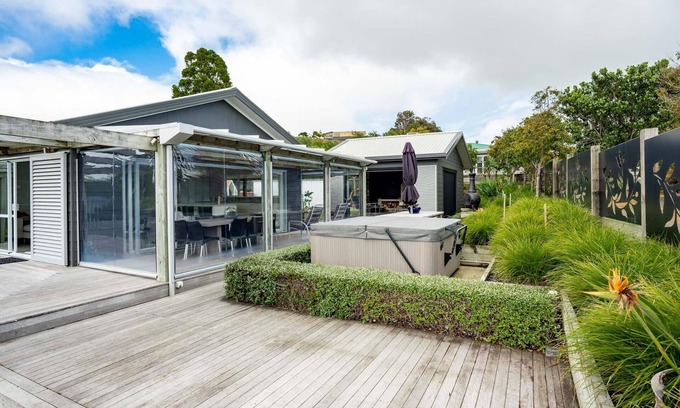 Mangawhai Heads House | Coastal Charmer - Modern holiday home with multiple covered outdoor entertaining spaces and spa