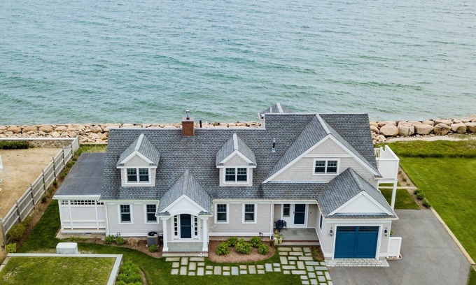 East Falmouth House | Coastal chic meets French Provençal in this newly renovated oceanfront home.