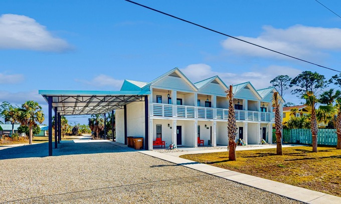 Port St. Joe House | Coastal getaway steps from the bay with patio, open layout, smart TVs, & W/D