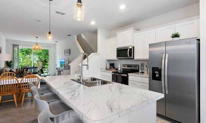 Baymeadows House | Coastal Living - Games/Pool/Volleyball