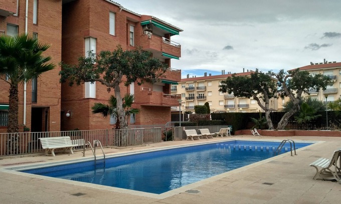 Comarruga Apartment | Comfortable apartment, Wi-Fi A/C and pool.