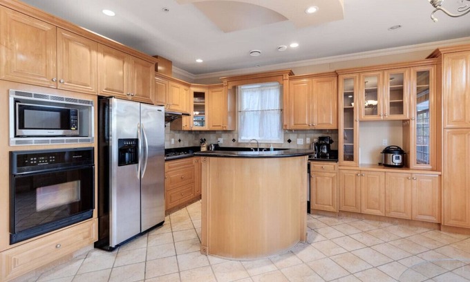 Marpole House | Comfy bedroom with 1/2 bath