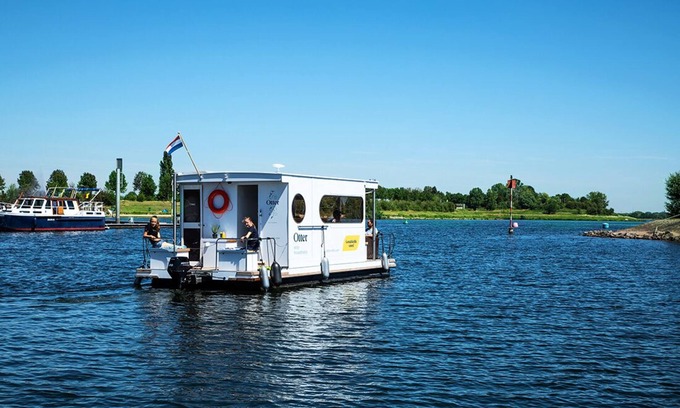 Ophoven Boat Rental | Compact Houseboat sailing and stationary for rent. No boating license required
