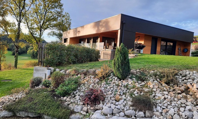 Entre-Deux-Monts House | Contemporary home with jacuzzi overlooking nature