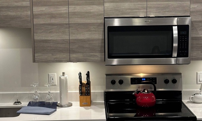 Vernon Condo | Contemporary studio retreat steps to the beach on Okanagan Lake.
