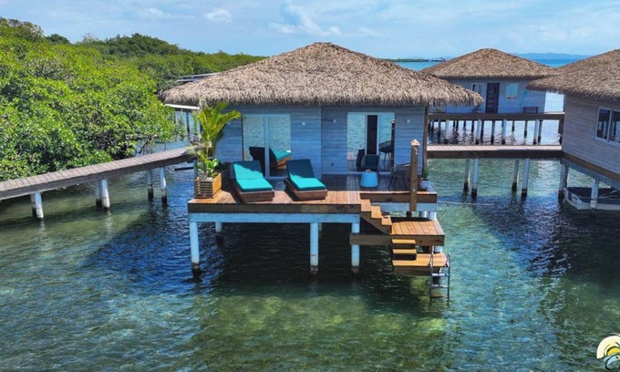 Isla Solarte House | Coral Reef Over Water Bungalow, Bedroom, King Bed, Living Room, Kitchenette