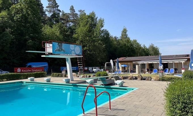 Bad Emstal House | Cosy apartment in villa for 3 guests with WIFI, pool, TV, terrace, pets allowed and parking