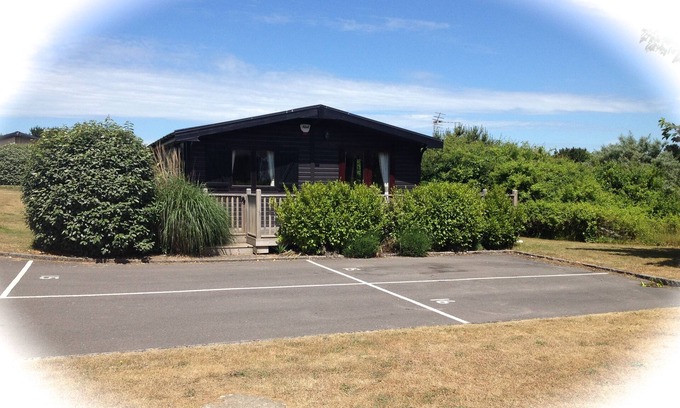 New Forest District Cabin | Cosy Log Cabin - very quiet part of Shorefields Park near Fishing Lake