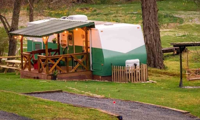 Canvas House | Cotch under a sugar maple tree w/firepit, swing and outdoor shower