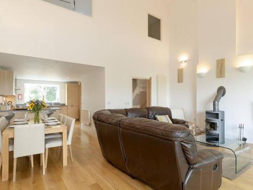 Cirencester House | Cotswolds Lake side home with luxury spa Swallows Nest,Lower Mill Estate, Lakeside home and spa with a Harry Potter cupboard under the stairs