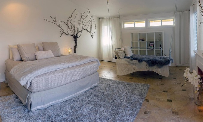 Talent Apartment | Cottage offers a sectional sofa, chef's kitchen and open floor plan.