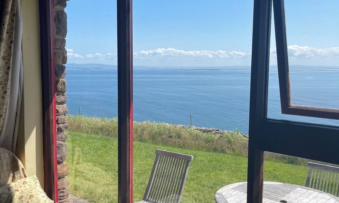 Brandon House | Cottage on Brandon Point on the Dingle Peninsula with sea and mountain views.
