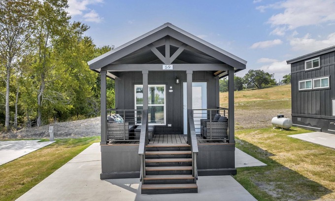 Brenham Cottage | Cottage with Bunk Beds - Includes 1 queen bed in the master, 2 bunk beds and 1 queen bed in the loft. A fully equipped kitchen, dining area, private bath and shower, TVs, Wifi, all utilities, access to all resort amenities. This cottage is pet friend