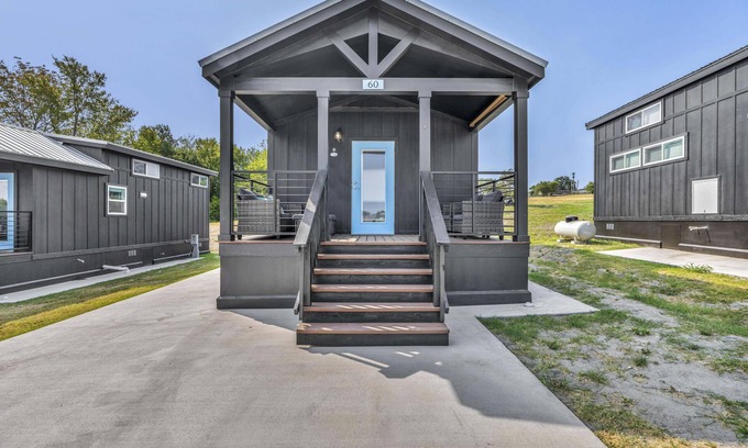Brenham Cottage | Cottage with Loft - Pet Friendly - Includes 3 queen beds (one in master and 2 in loft), a fully equipped kitchen, dining area, private bath and shower, TVs, Wifi, all utilities, access to all resort amenities. This cottage is pet friendly.